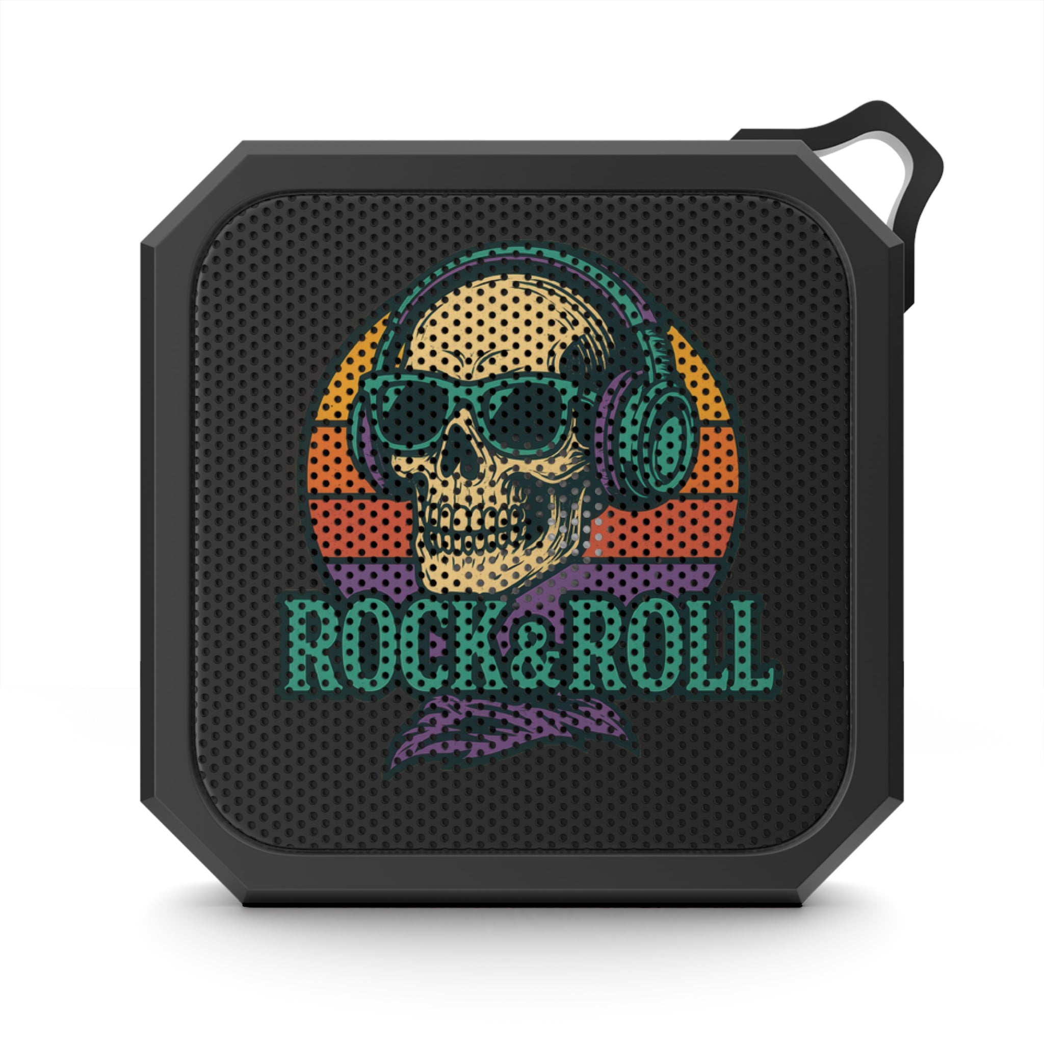 Portable IPX6 Bluetooth speaker with skull design hanging outdoors
