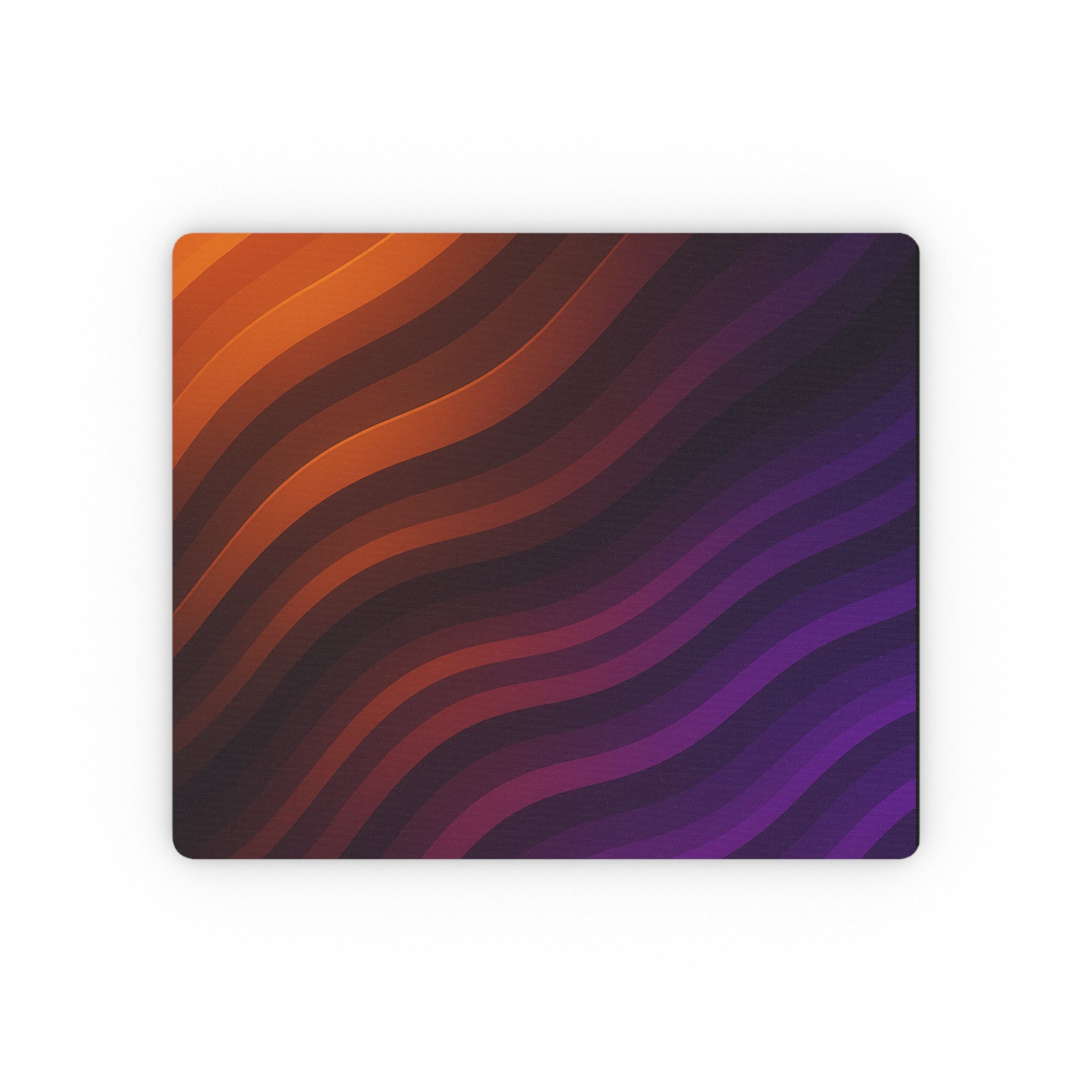 Modern mouse pad with wave gradient design on a minimalist desk
